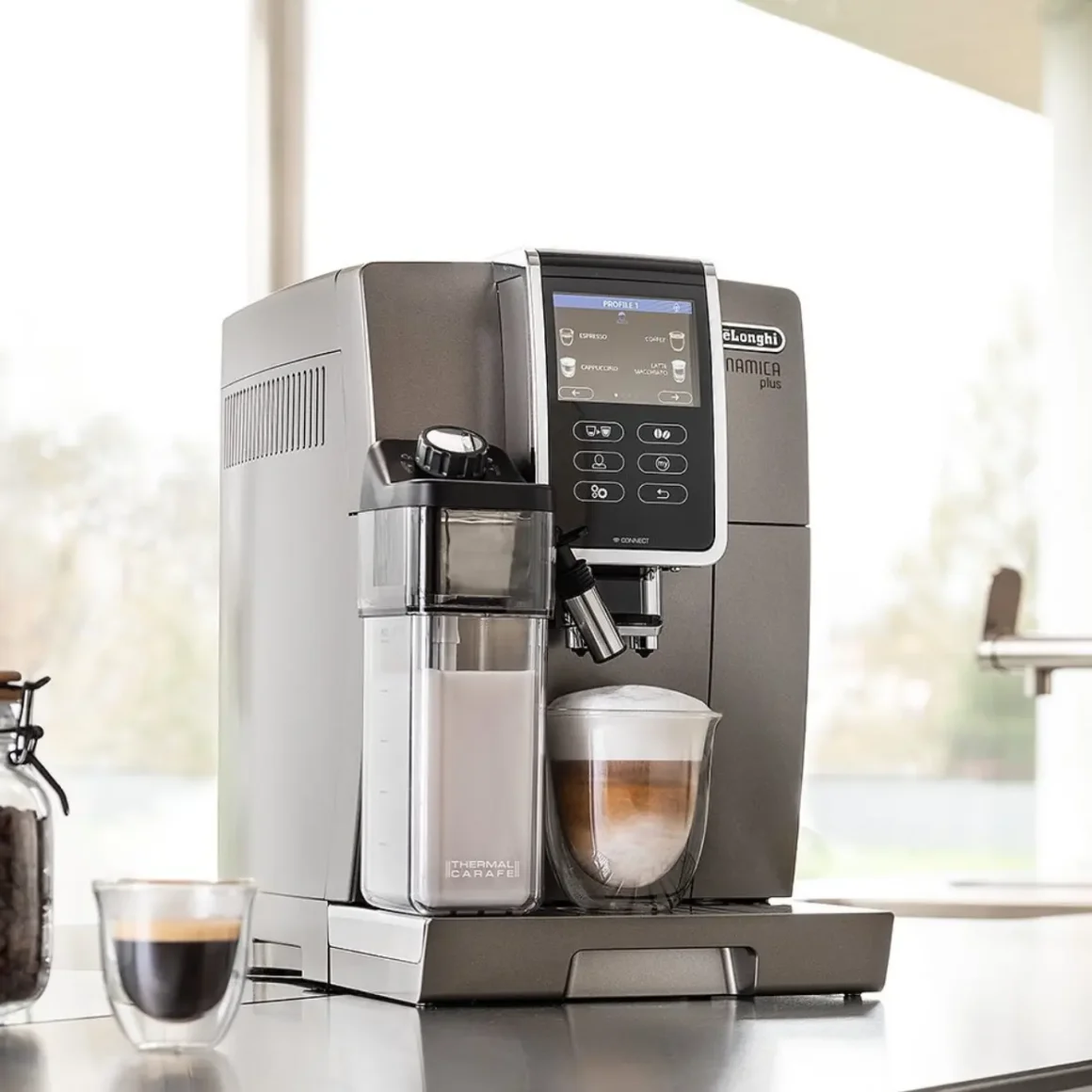 a delonghi dinamica plus coffee maker on a counter