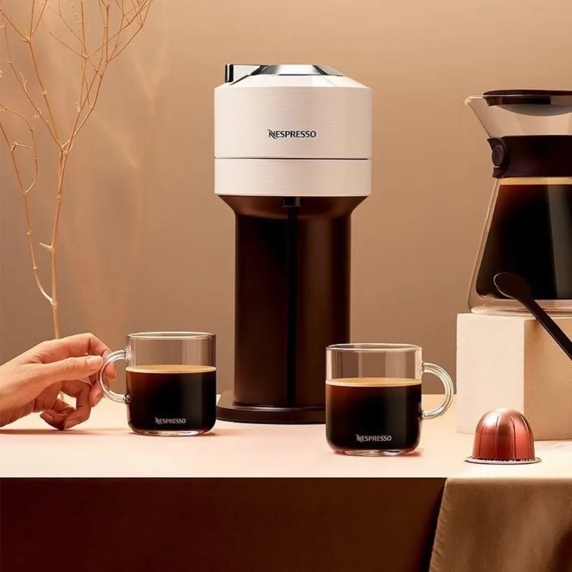 a person holding a cup of coffee