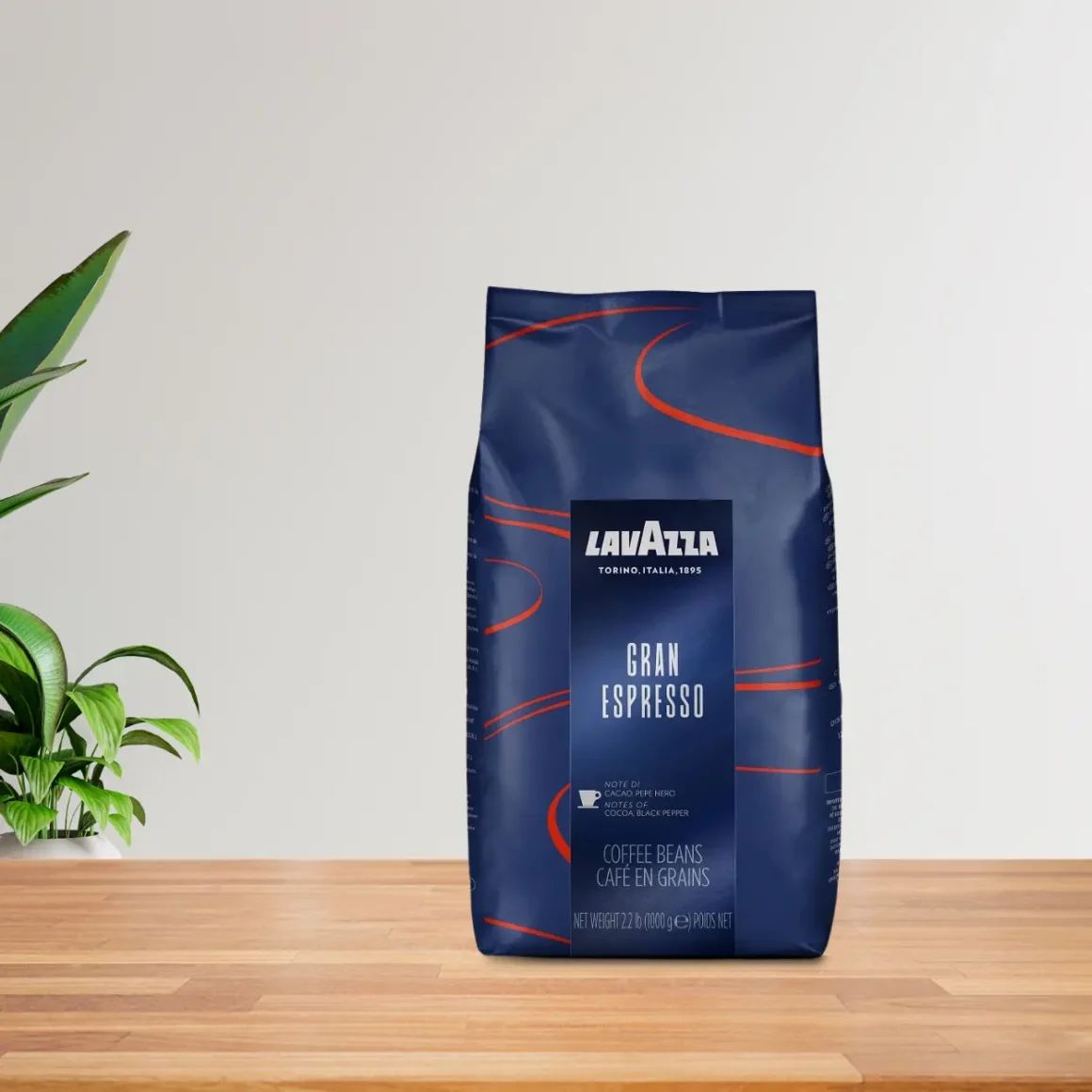 a blue bag of lavazza gran espresso coffee on a table