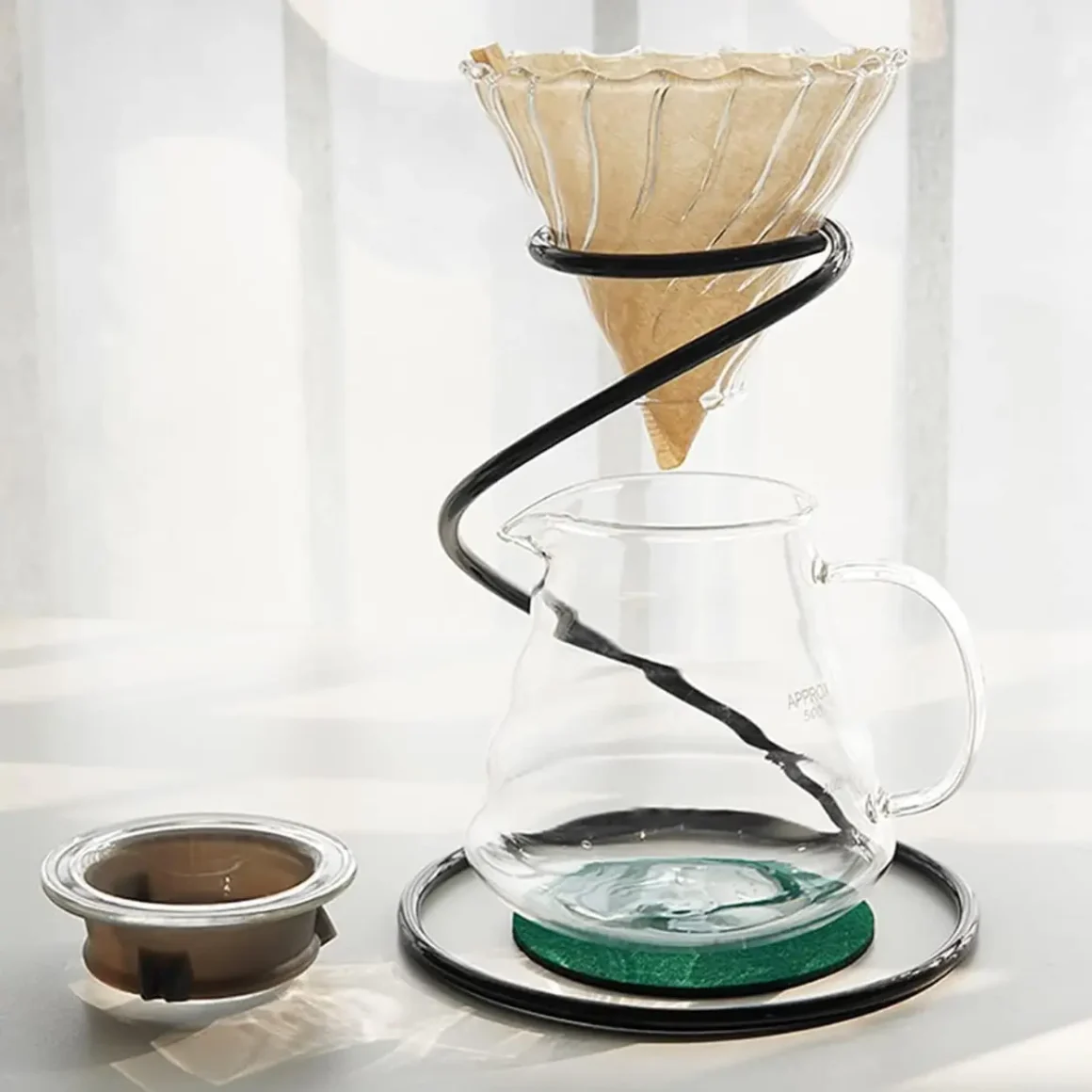 a lejostol metal pour-over coffee dripper stand on a table