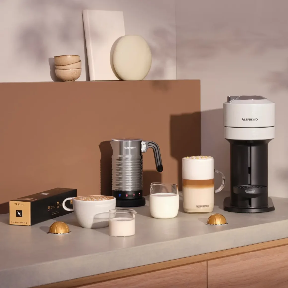a coffee machine and milk on a counter