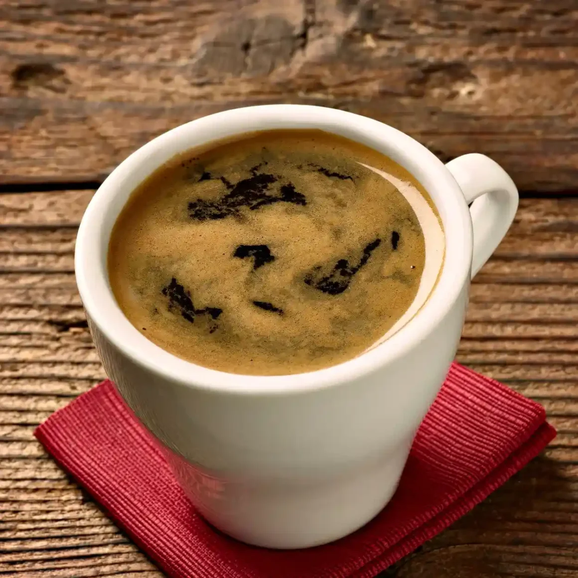 a cup of regular espresso on a napkin