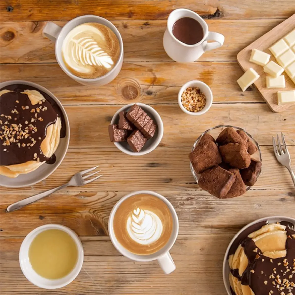 a table with coffee and desserts
