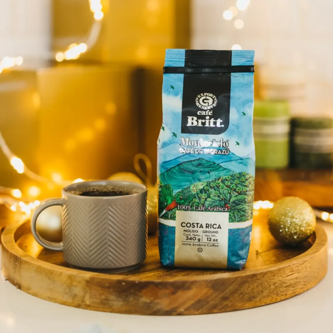 a coffee cup and bag of tarrazú costa rican montecielo by café britt on a tray