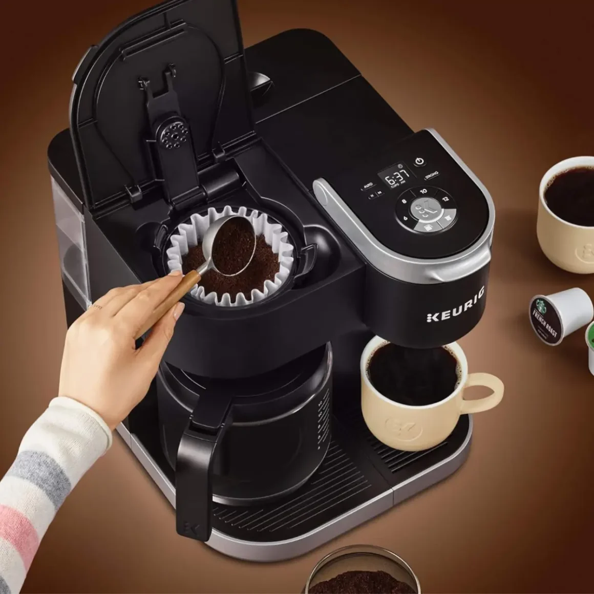 a person using a keurig k-duo coffee machine