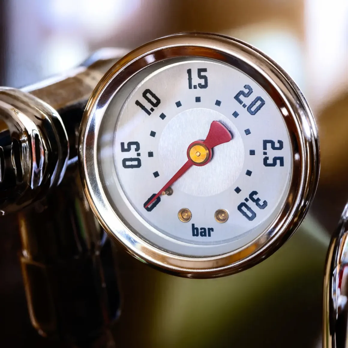 a gauge on an espresso machine