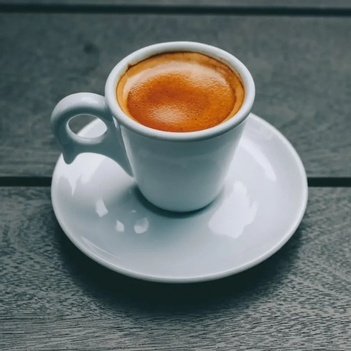 a cup of espresso on a saucer