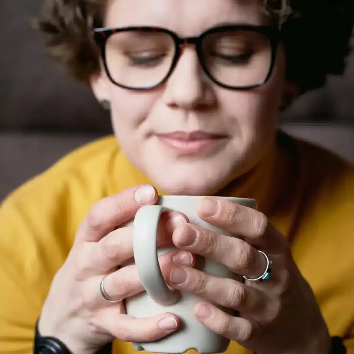 a person holding a cup espresso coffee