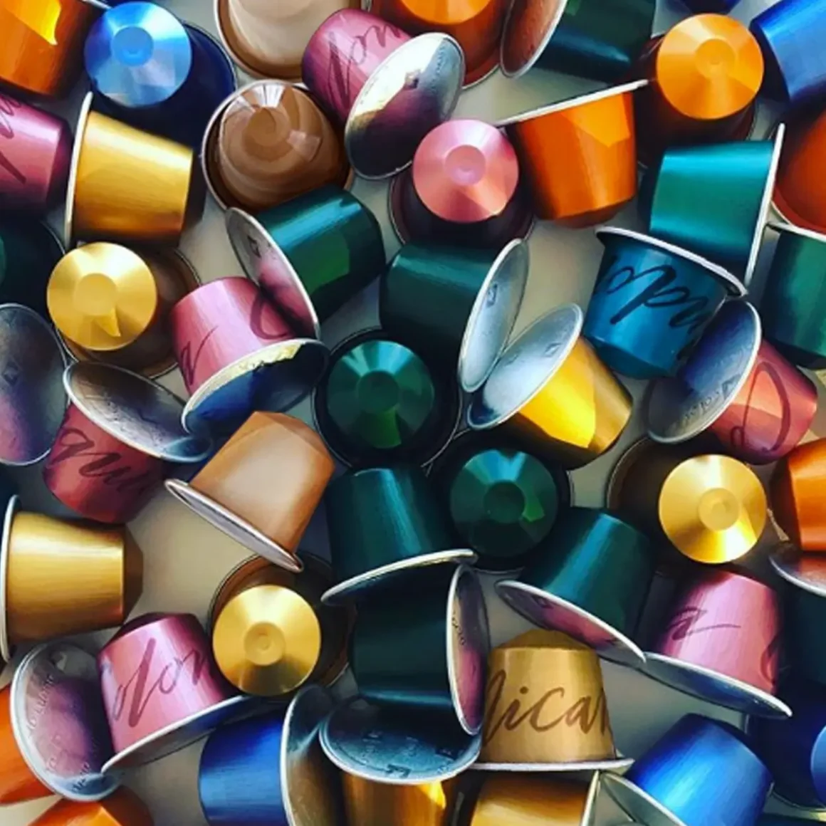 a group of colorful nespresso pods