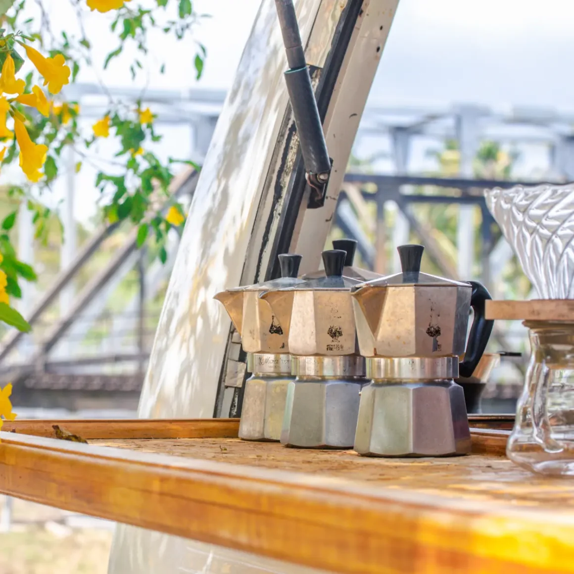 a group of moka pots on a table