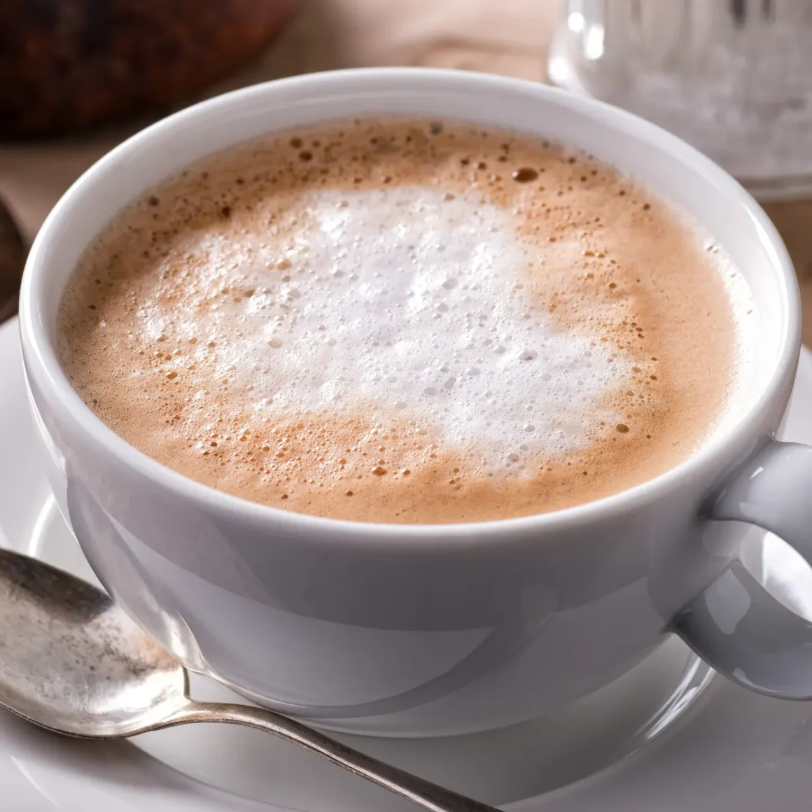 a cup of coffee with foam