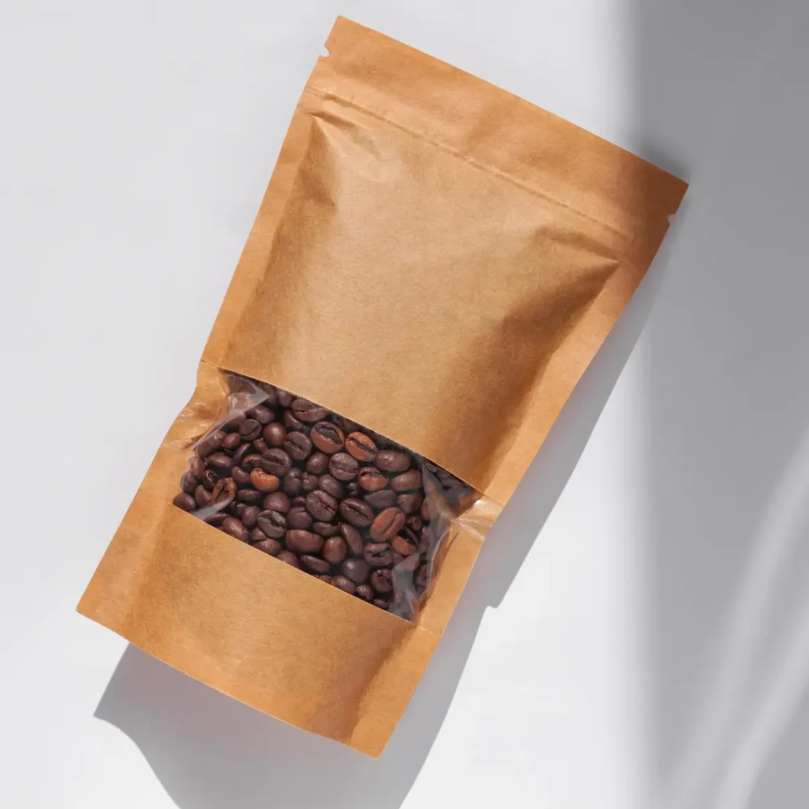 a brown bag with coffee beans in it