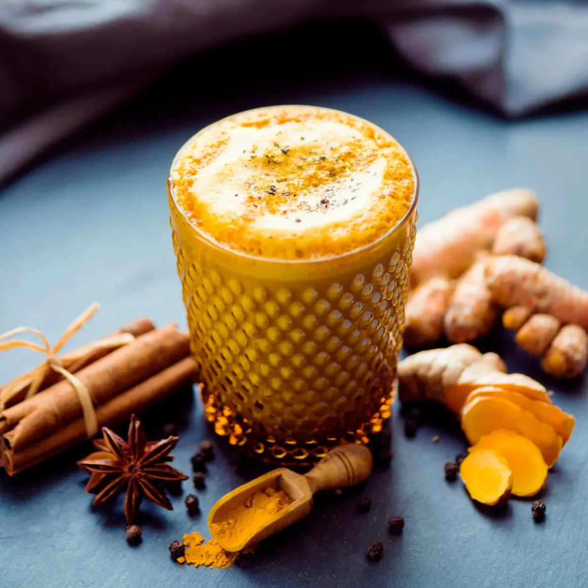 a glass of turmeric coffee with spices