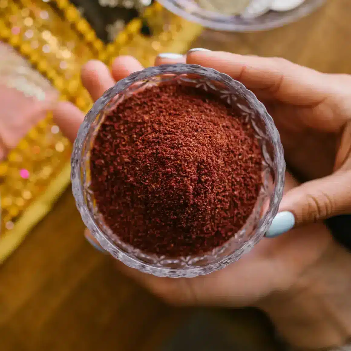 a person holding a bowl of espresso powder
