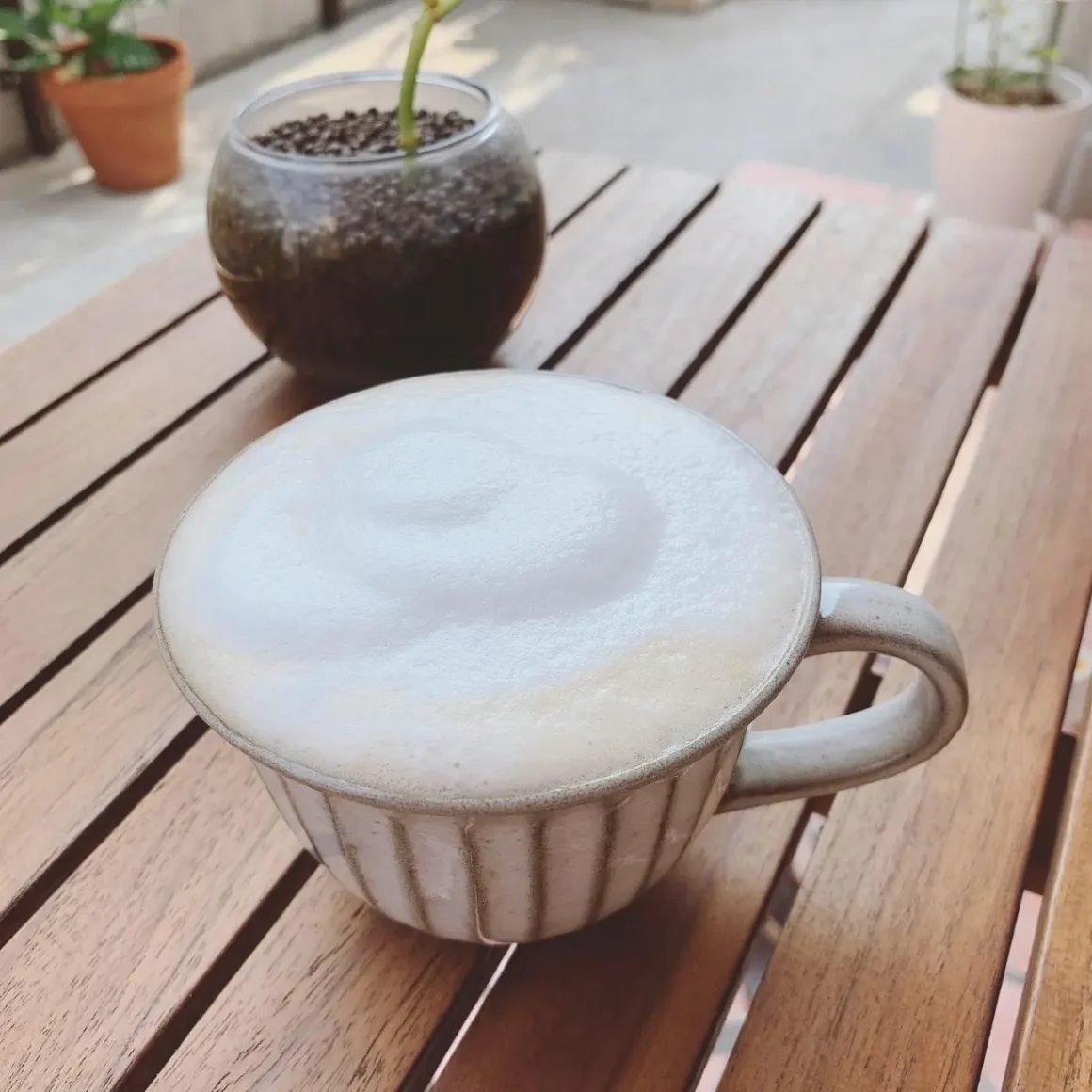 a cup of cafe con leche on a table