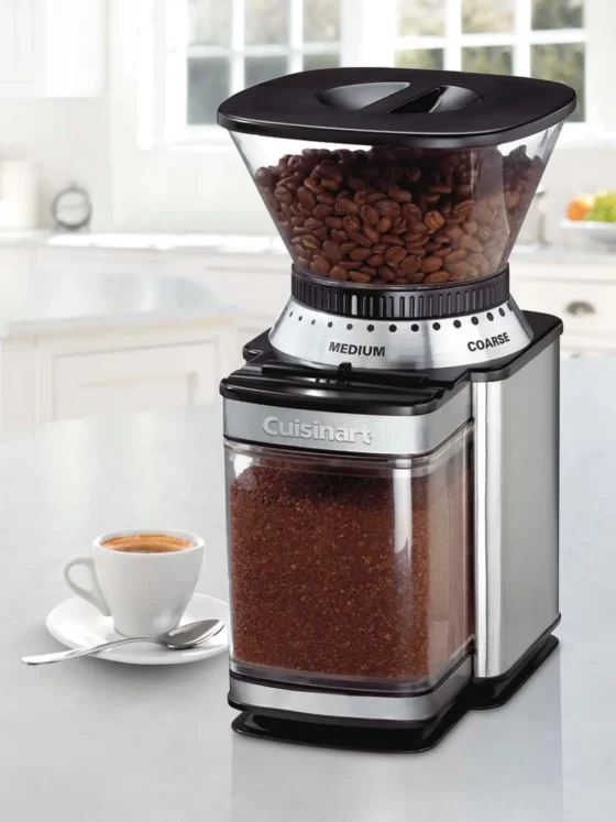 a supreme grind cuisinart burr coffee grinder with a cup of coffee on a saucer