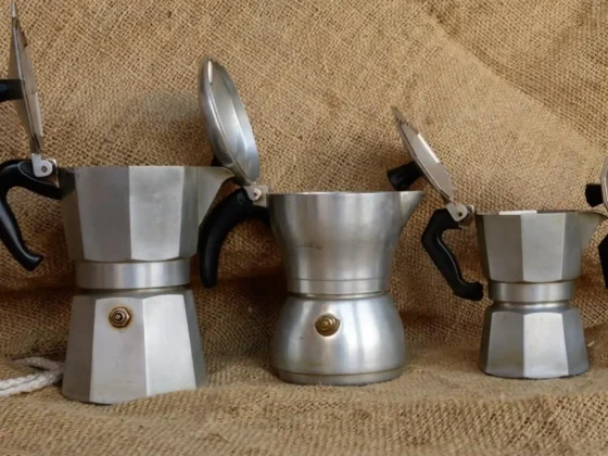 a group of moka pots with a lid open