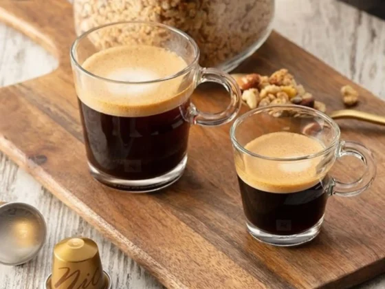 a glass of double espresso and gran lungo on a wooden board
