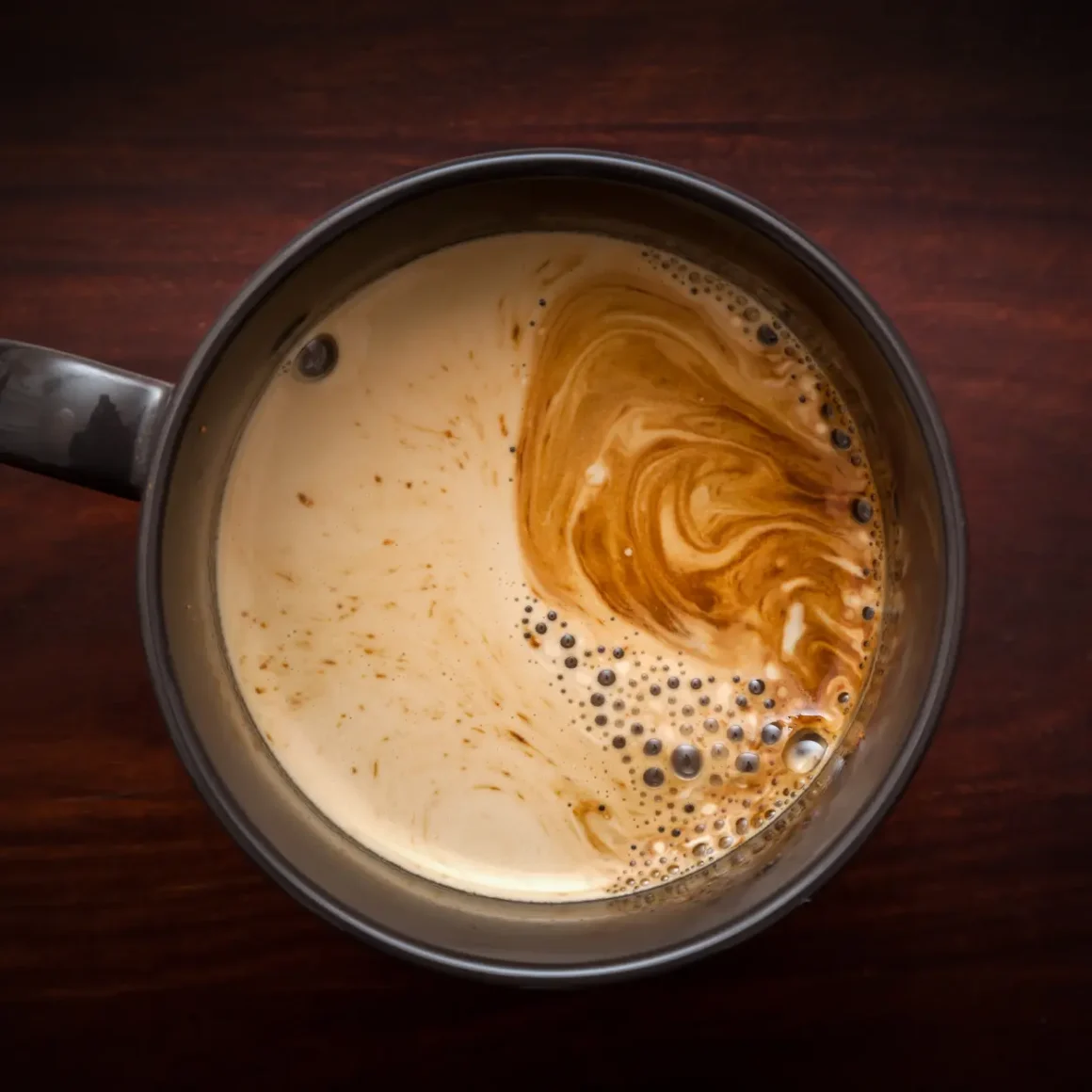 a cup of coffee with foam