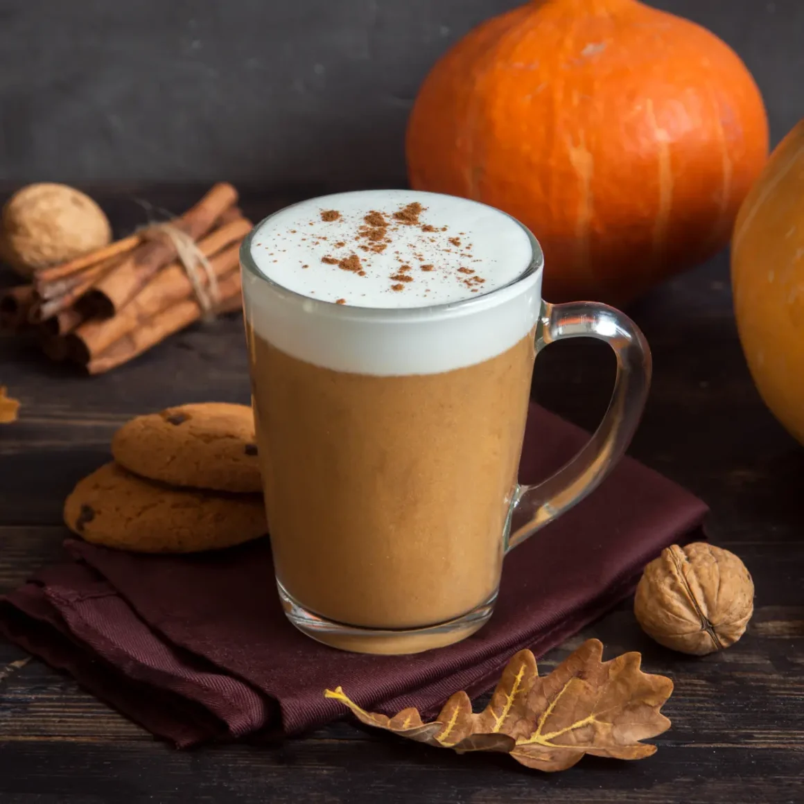 a glass mug of mocha and pumpkins