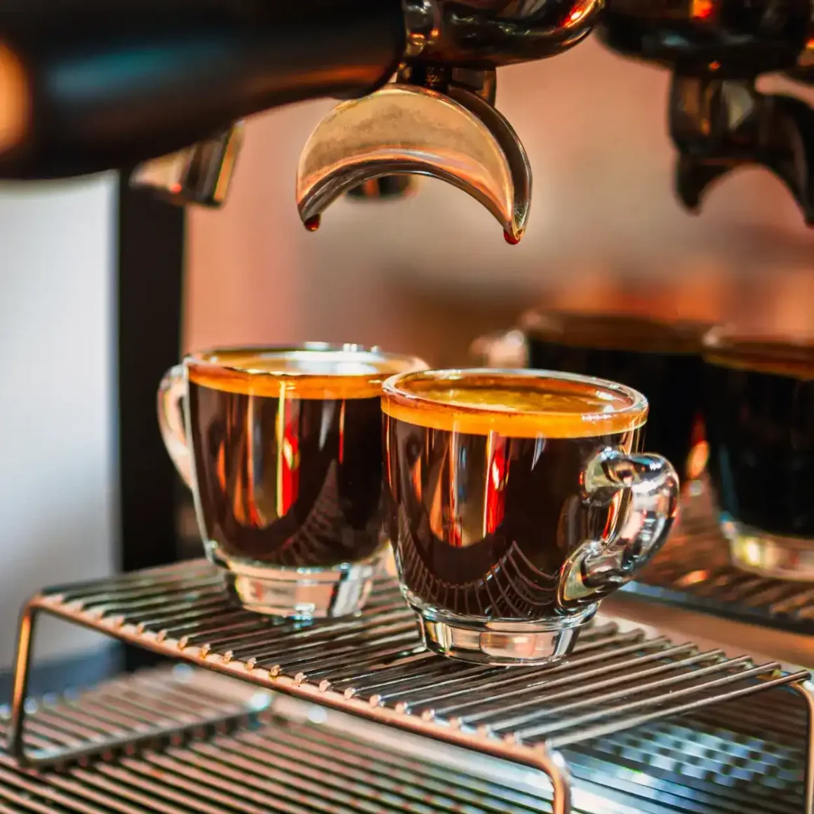 a group of doppio espresso cups on a rack