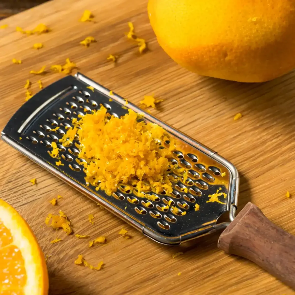 a grated orange on a wooden surface