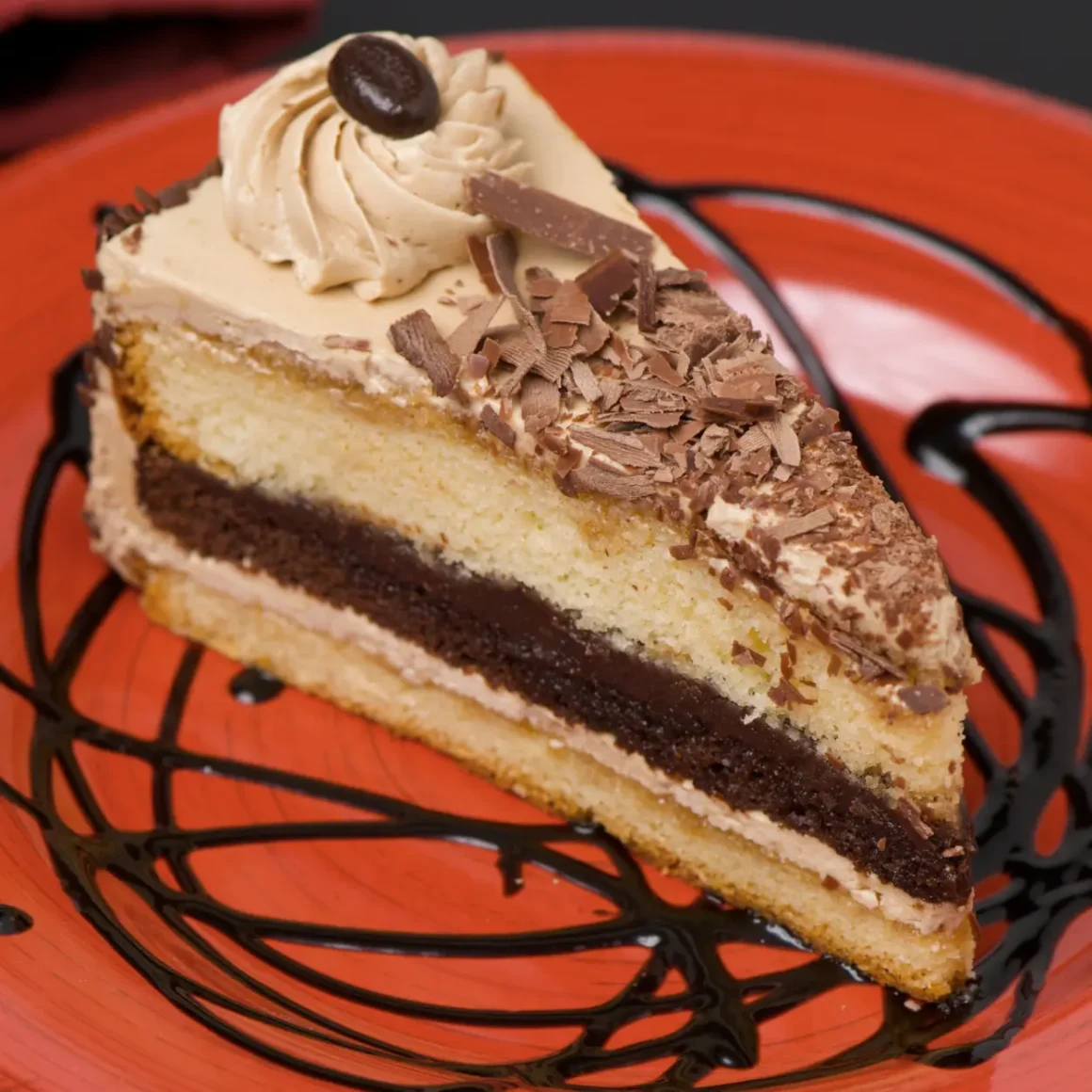 a piece of cake on a red plate