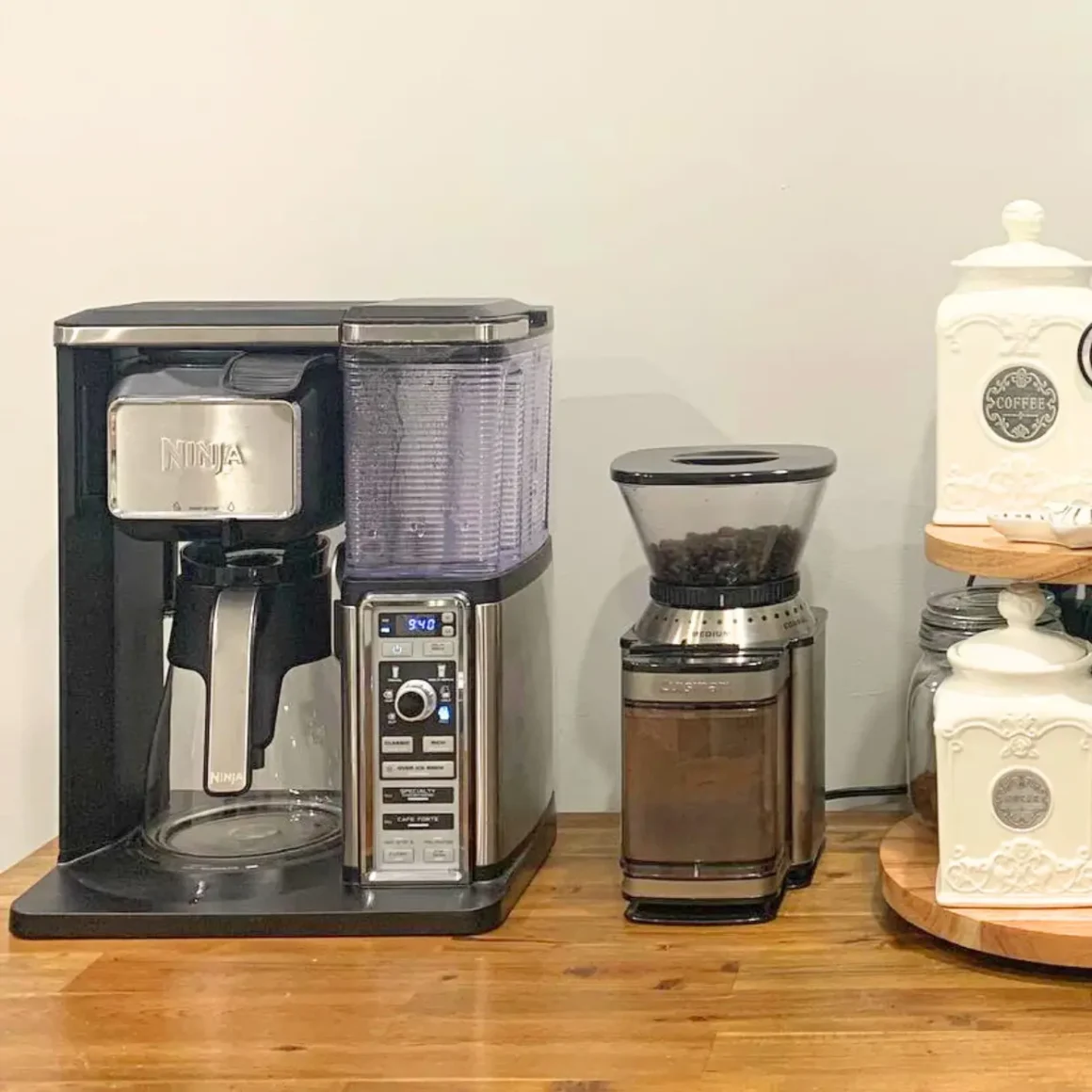 a coffee maker and supreme grind cuisinart burr coffee grinder on a table