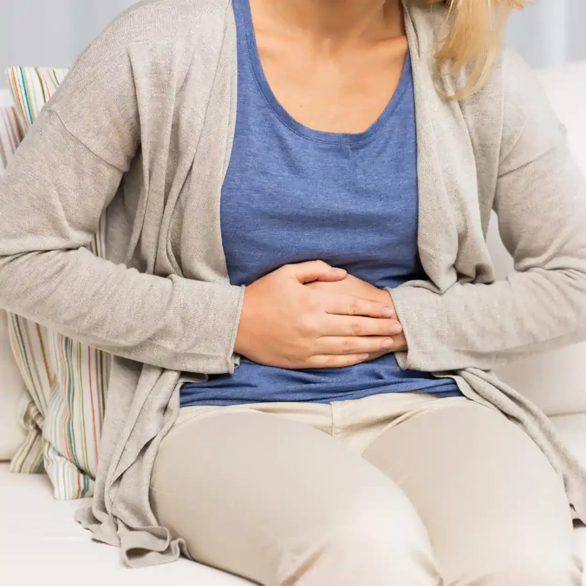 a person holding her stomach