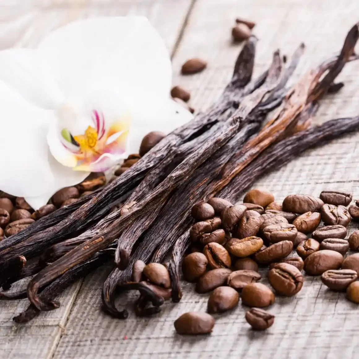 vanilla sticks and coffee beans with a flower