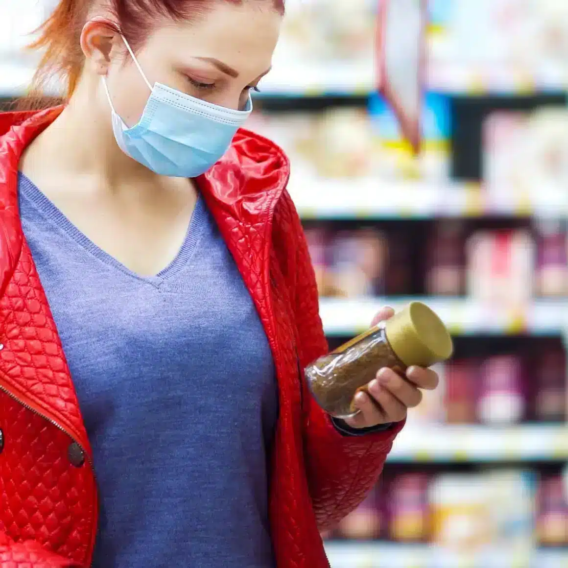 a woman wearing a mask and holding a espresso coffee