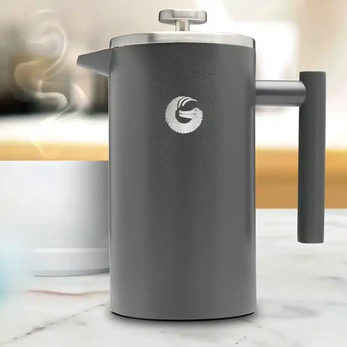 a coffee gator french press coffee maker on a marble counter