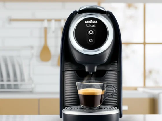 a lavazza blue classy mini coffee maker with a cup of coffee