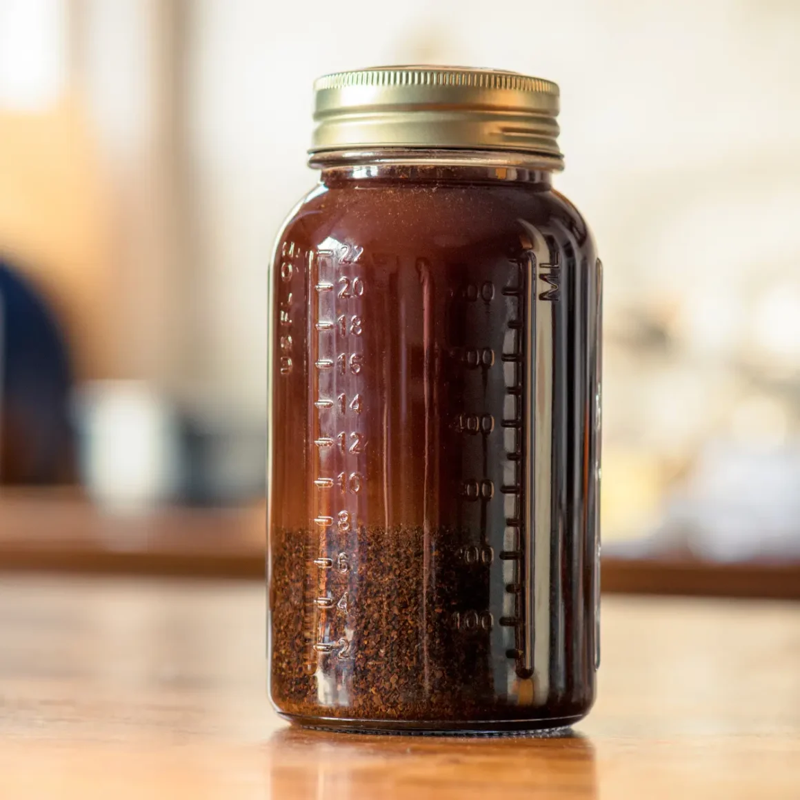 a jar of cold brew coffee on a table