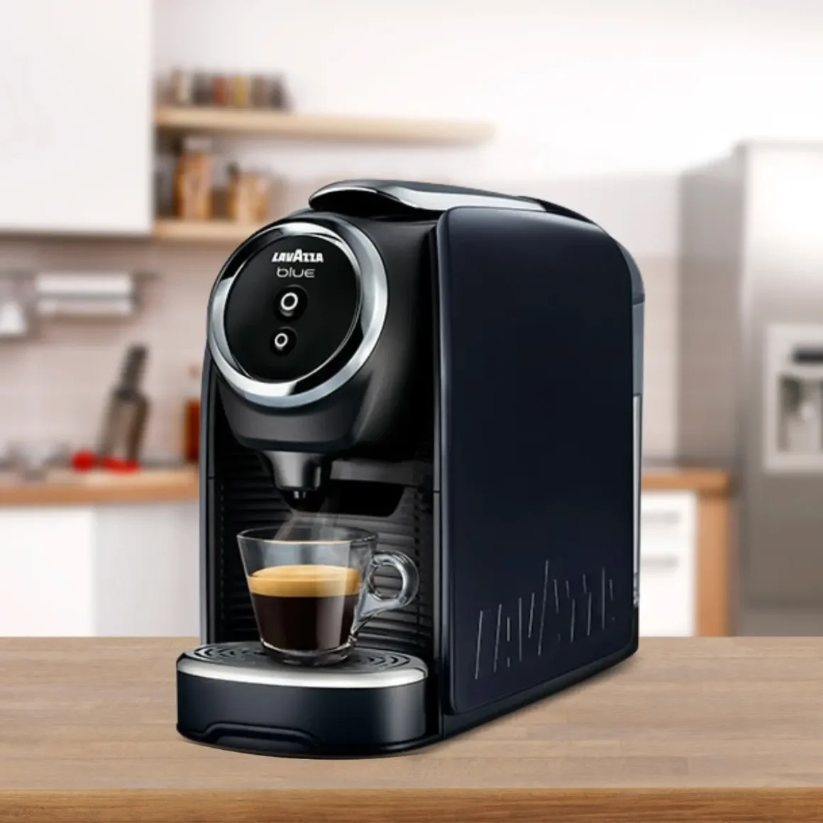 a black lavazza blue classy mini coffee maker with a cup of coffee