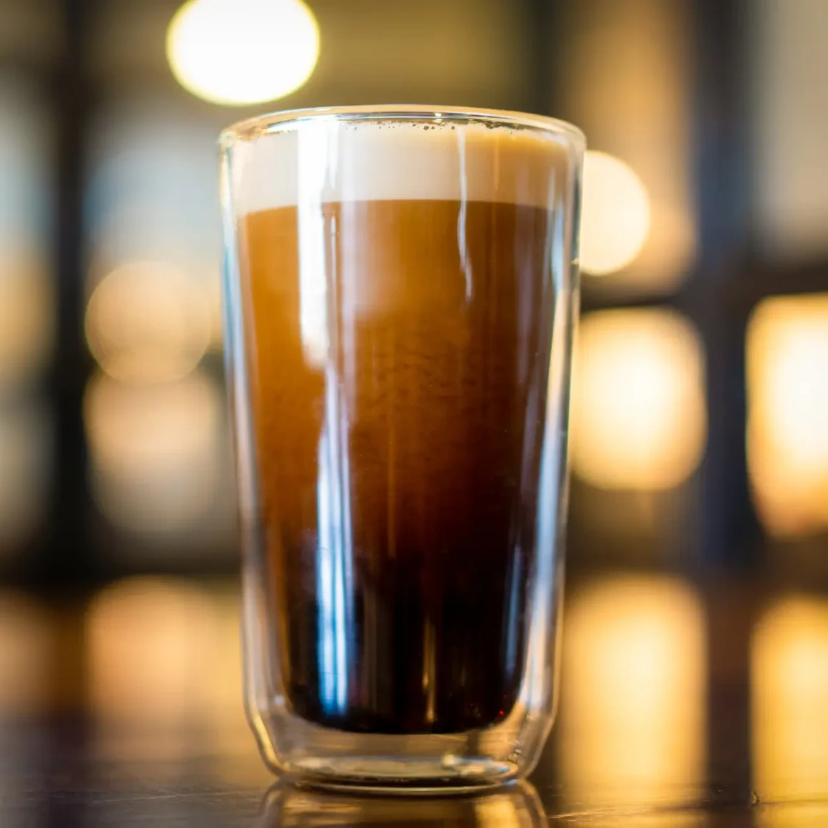 a glass of nitro cold brew coffee